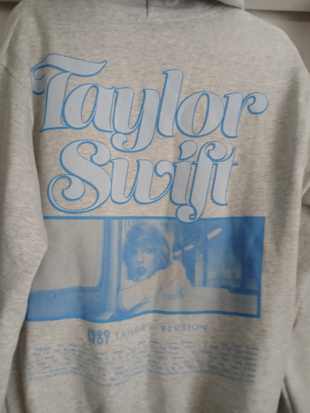 Taylor Swift Light Gray Hoodie with Sky Blue Graphic